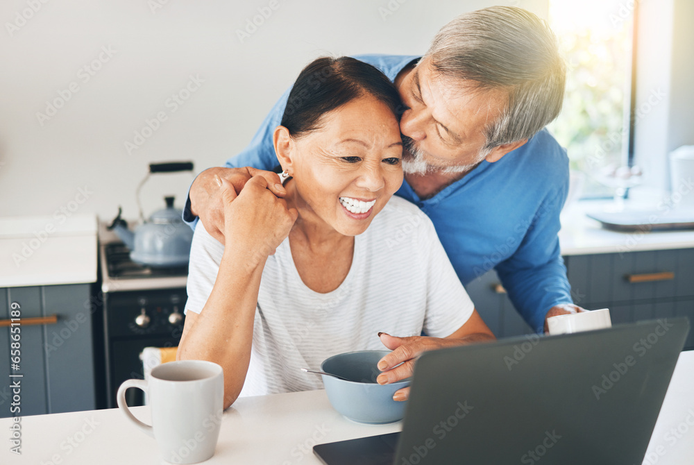 Couple, love and laptop in kitchen for morning news, happy planning and watch video, streaming service or work from home. Mature woman and man with breakfast, kiss and computer, internet or website