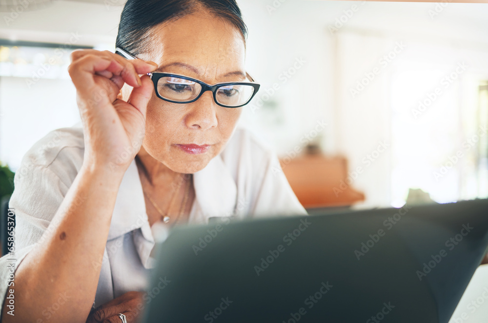 Mature woman, glasses and reading on laptop for blog or article on eye care, health and lens sale or discount. Business person with vision and computer in work from home job or optometry website