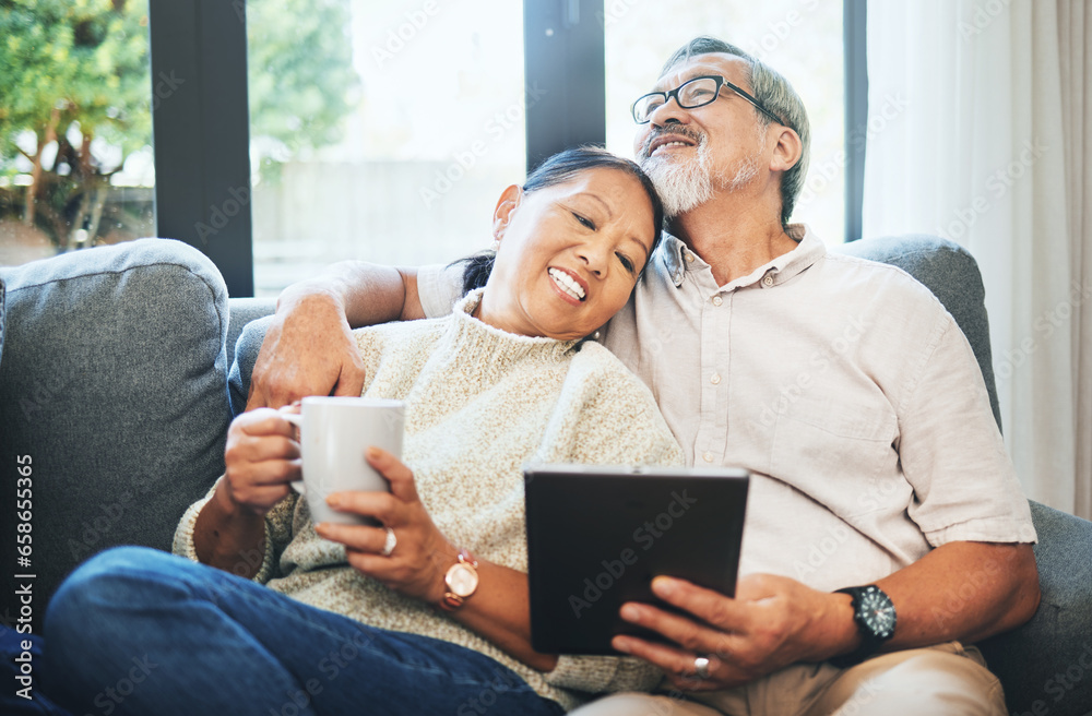 Tablet, coffee and senior couple on sofa bonding, relaxing and networking on social media together. Happy, digital technology and elderly man and woman in retirement scroll on mobile app or internet.