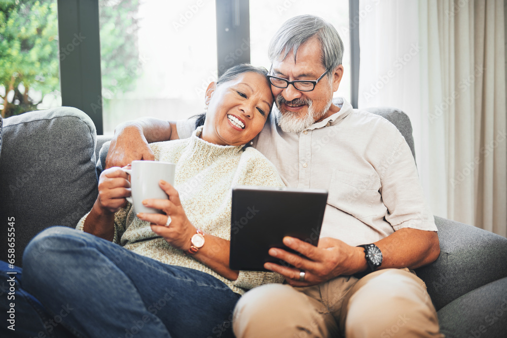 Tablet, coffee and senior couple on sofa bonding, relaxing and networking on social media together. Happy, digital technology and elderly man and woman in retirement scroll on mobile app or internet.