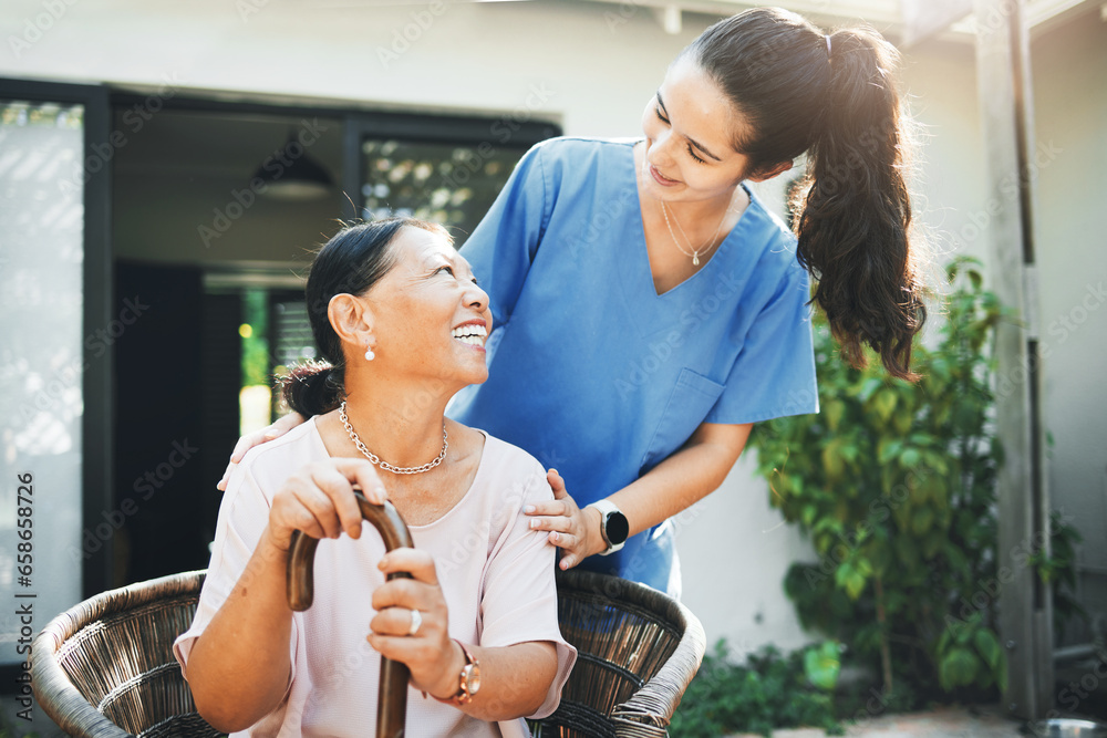 Senior woman, happy nurse and garden for health support, .conversation and wellness in retirement or nursing home. Medical doctor talking to elderly patient with disability and walking stick outdoor