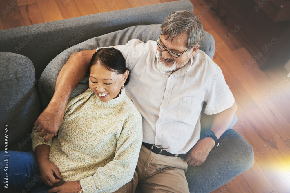 Relax, love and senior couple on a sofa hugging, bonding and laying together in the living room. Happy, smile and elderly man and woman in retirement resting on a weekend in the lounge at modern home