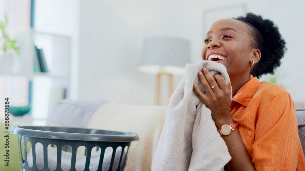 Clean, smell and happy woman with laundry in home or basket with clothes, linen or maid spring cleaning in apartment. Black person, washing or clothing with detergent or cleaner scent on fresh fabric