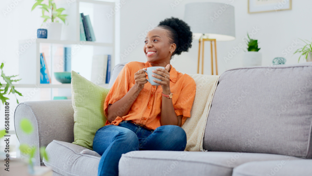 Black woman, smiling and couch with tea, relaxing and cozy home for self care, living room and break. Me time, comfort and quality time in house, sofa and day off for resting, laughing and happiness