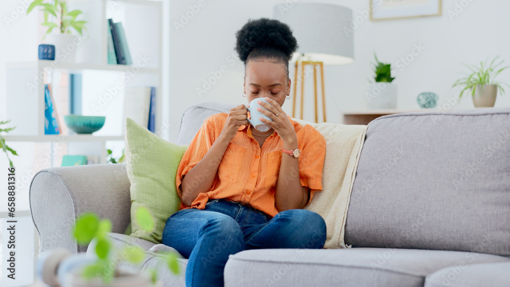 Black woman, home and drinking coffee on sofa, relaxing and smiling for self care, living room and break. Me time, comfort and quality time in house, sofa and day off for rest, laughing and happiness