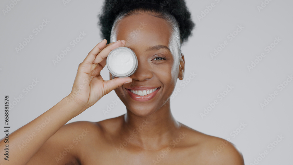 Face, model and hands with eye cream for cosmetic, hand gesture and beautiful skin in studio background. Black woman, moisturizer and serum for dermatology with self care portrait and smile in mockup