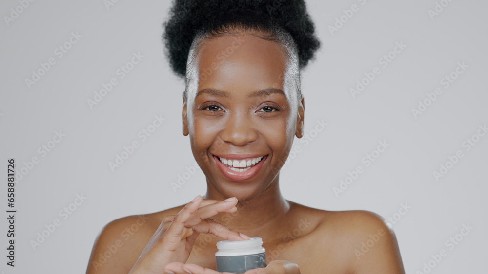 Face, model and hands in beauty cream for cosmetic, glow and happiness with skincare in studio background. Black woman, healthy skin and dermatology for cosmetics in moisturizer, smile and mockup