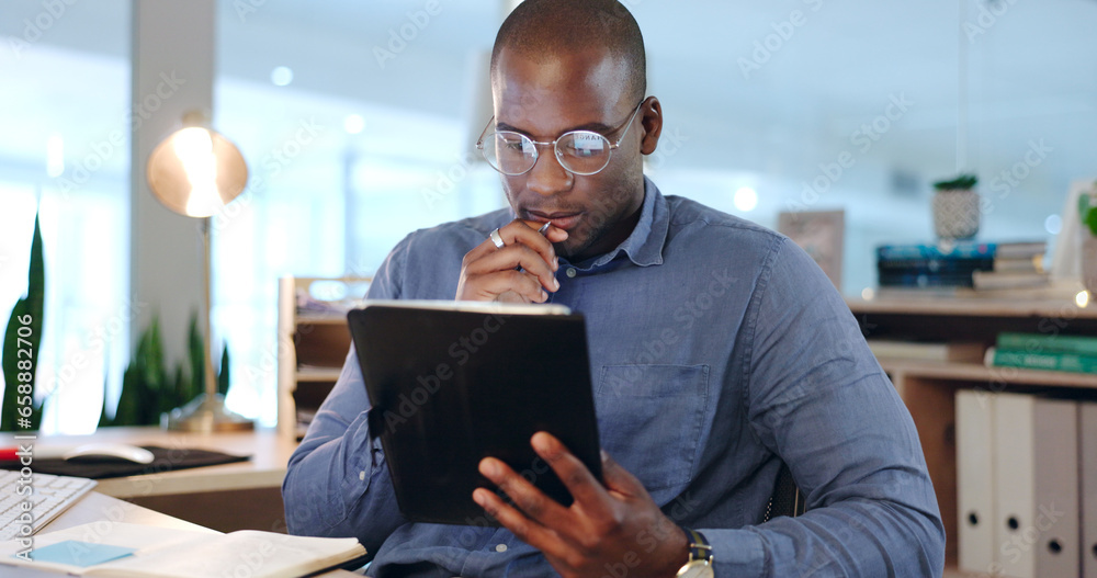 Businessman, hold and tablet while thinking in office, late and work on app, telemarketing or analytics. Black person, face and reading of reports of data, online or documents for customer support