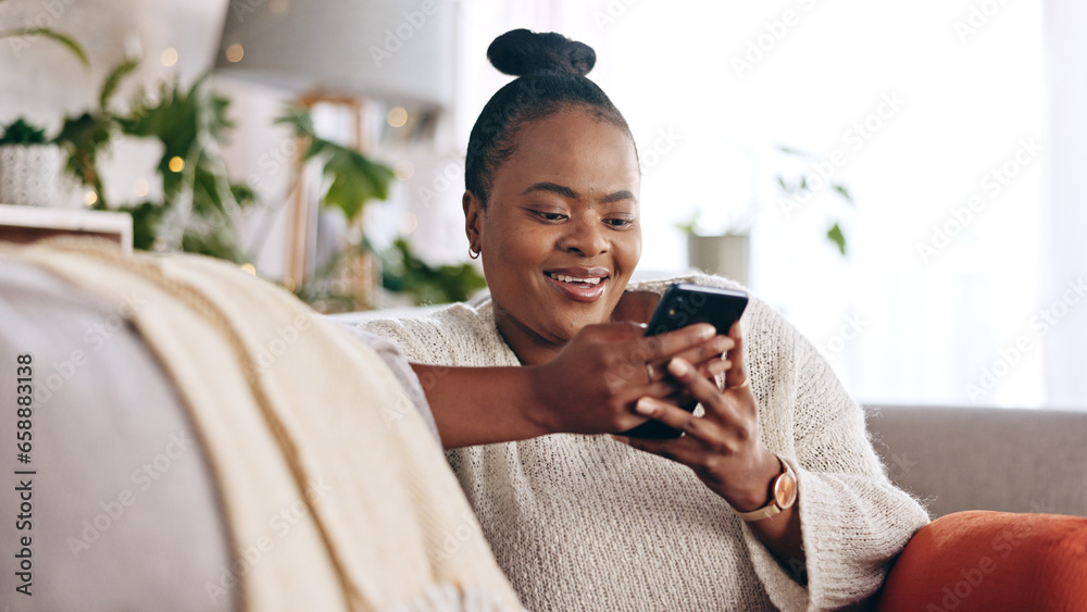 Black woman, reading and using phone with smile in home or social media, mobile app and communication online. Funny, meme or person on couch streaming video or typing on cellphone in living room