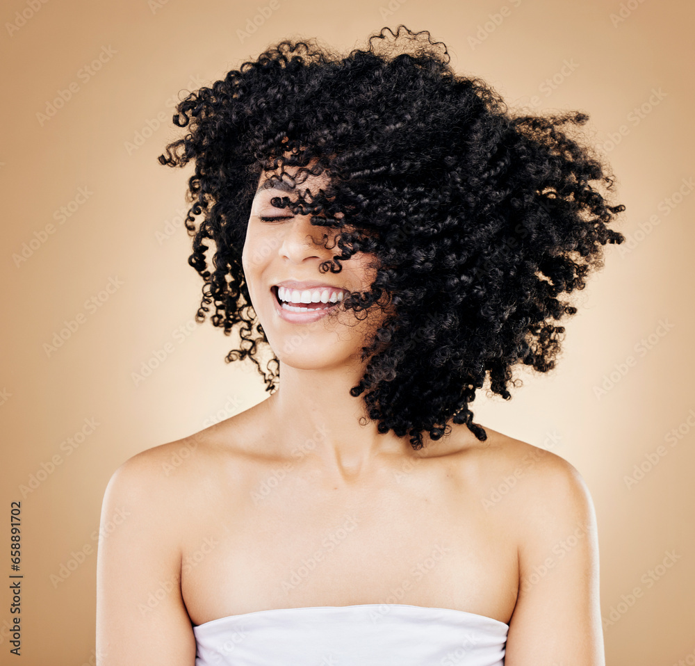 Woman, curly or afro hair wind on fun studio background for healthy hairstyle growth, texture or frizz treatment. African beauty model, shake energy and happy change by shampoo transformation results