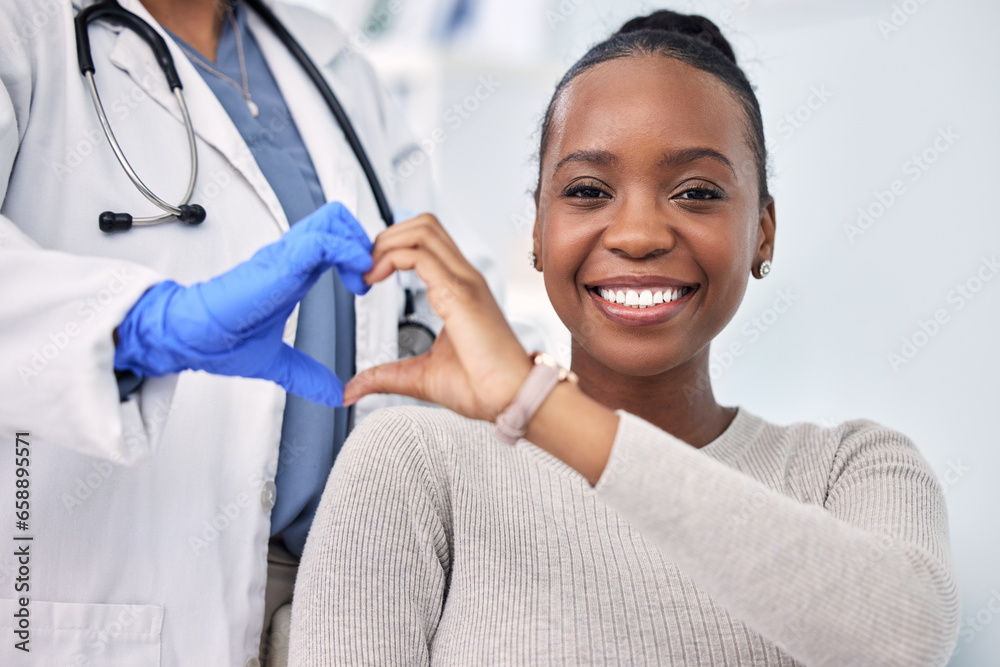 Black woman, patient and doctor with smile, consultation and heart emoji for cardio health, checkup and appointment. Happiness, support and wellness for medicine, healthcare and physical examination