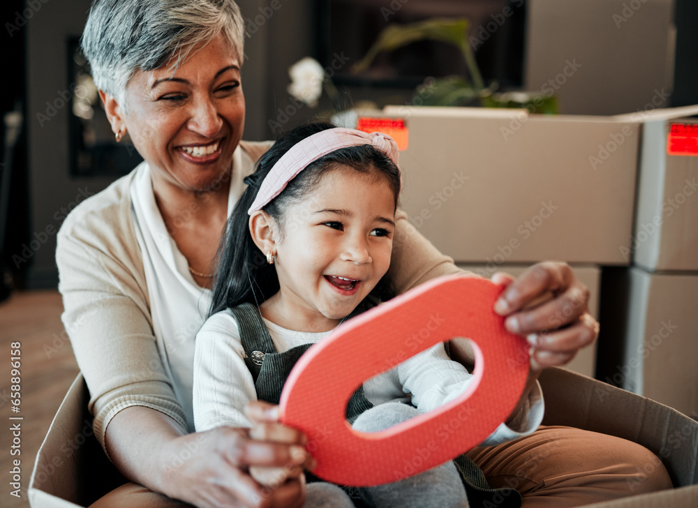 Senior woman, kid and moving boxes with smile, playing and happy with grandmother, grandchild or new property. Family home, excited and enjoying at house, driving and bonding for memories, fun or joy