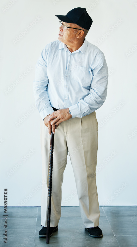 Mature, person and walking stick while thinking with health, recovery and rehabilitation for assistance. Elderly, man or grandfather at medical office for doctor appointment, diagnosis or results