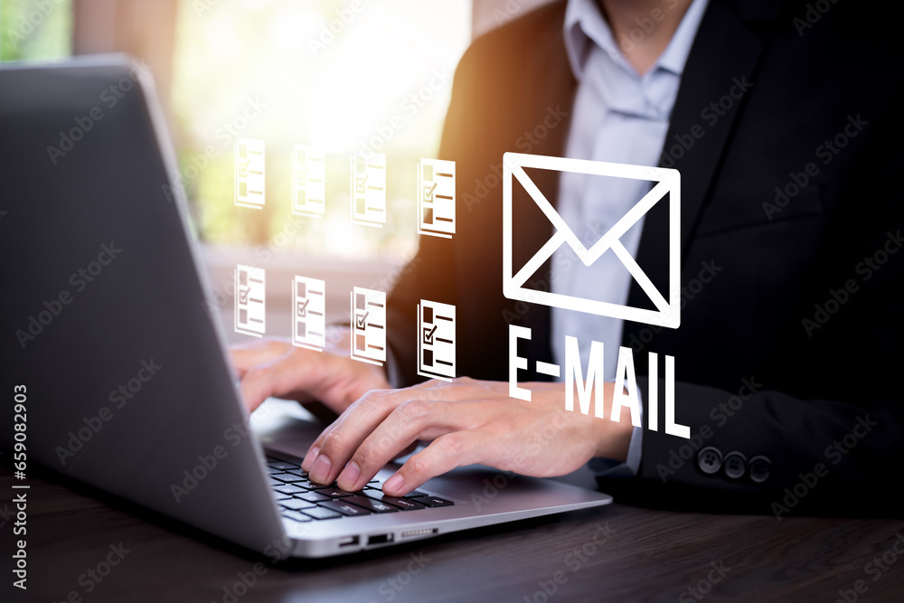 Business people using laptops with communication icons, letter icons, email icons, and newsletter email and protect their personal information or spam mail, Customer service call center contact.