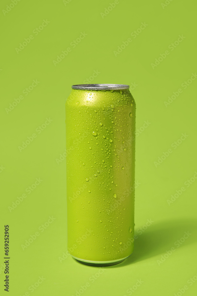 Can of fresh soda on green background