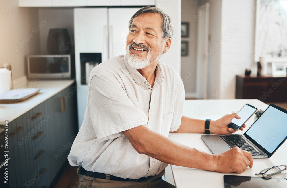 Laptop, research and senior man in the kitchen networking on social media, website or the internet. Happy, technology and elderly Asian male person in retirement browsing on computer in modern home.