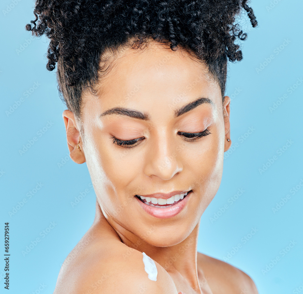 Skincare, face and happy woman with body cream, lotion or moisturizer for self care, collagen treatment or skin hydration. Sunscreen protection, shoulder and studio model smile on blue background