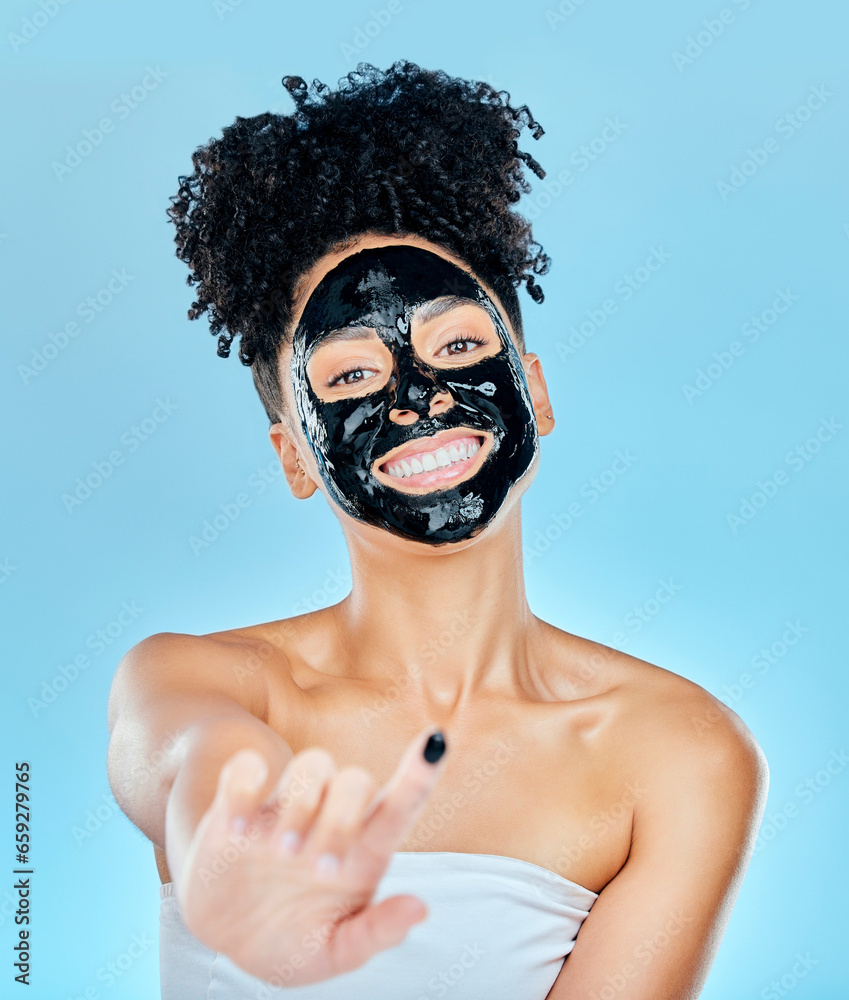 Skincare, face mask and portrait of woman with finger for facial treatment, anti aging or wellness. Beauty, studio and happy person apply products for health, cosmetics or grooming on blue background