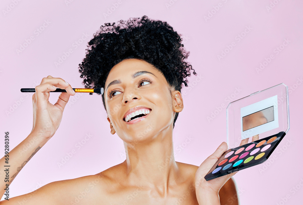 Face makeup, palette and happy woman with brush, beauty routine and apply cosmetics powder, foundation or product. Happiness, skincare shine and studio person with skin treatment on pink background