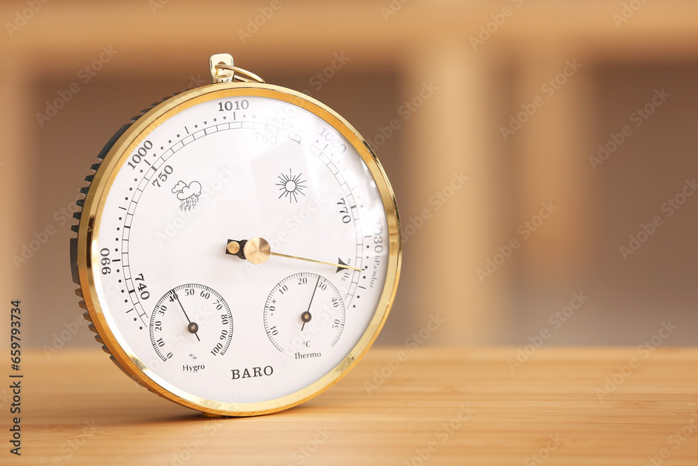 Aneroid barometer on table in room, closeup