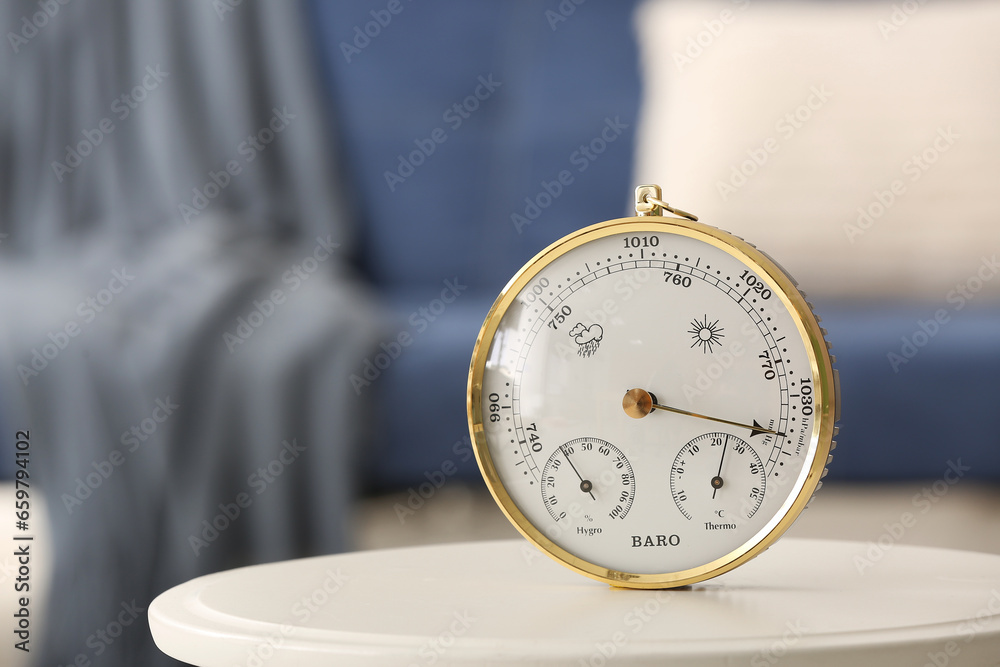 Aneroid barometer on table in room, closeup