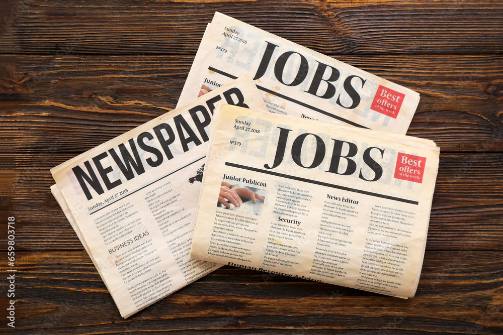 Morning newspapers on wooden background