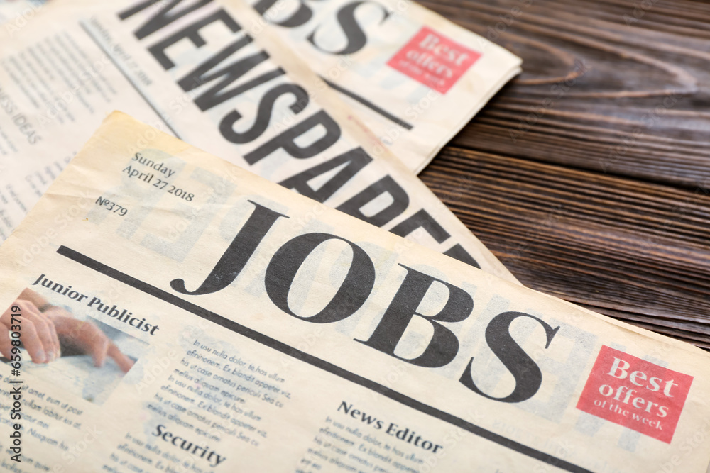 Morning newspapers on wooden background