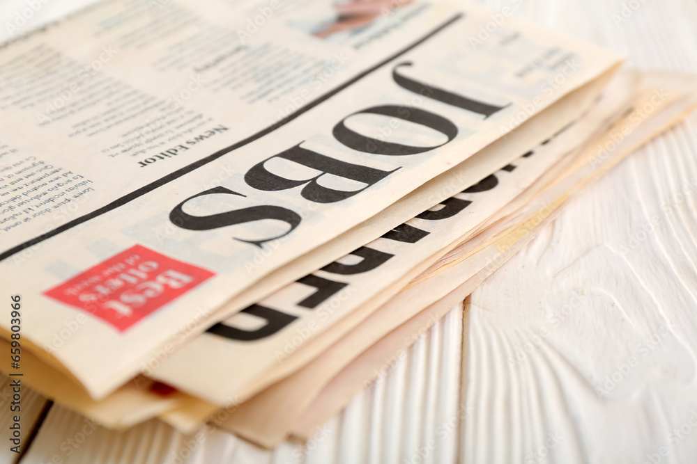 Morning newspapers on white wooden background