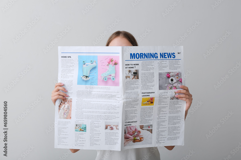 Woman reading morning newspaper on white background