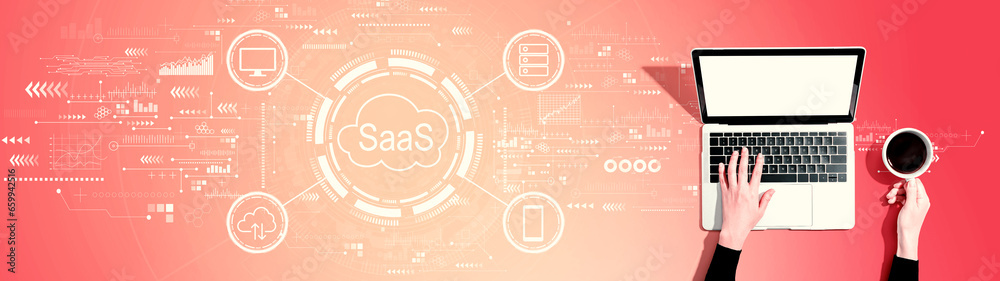 SaaS - software as a service concept with person using a laptop computer