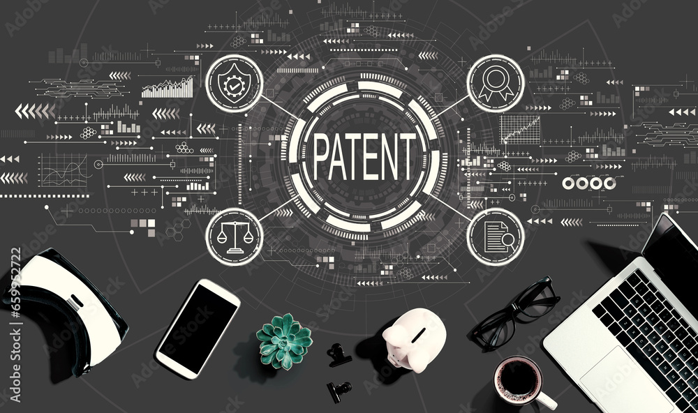 Patent concept with electronic gadgets and office supplies - flat lay