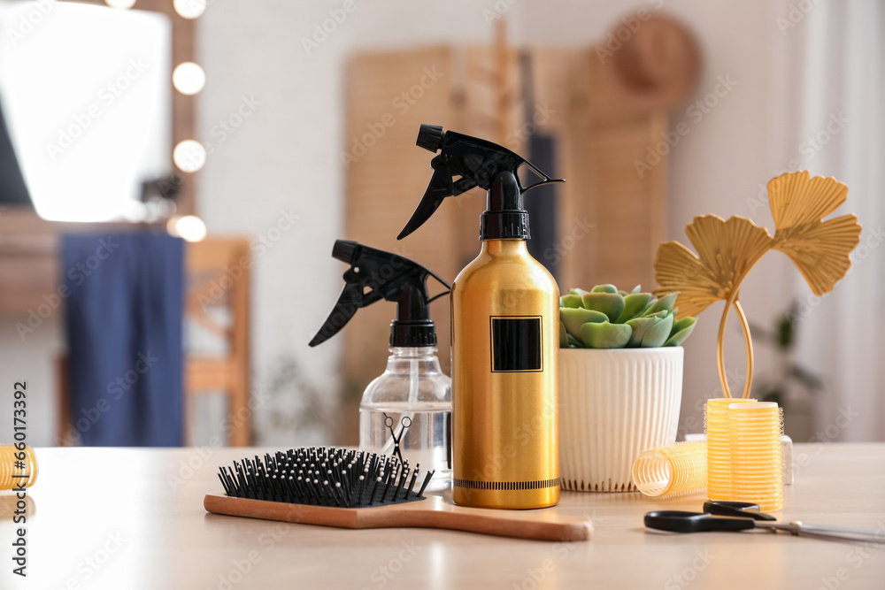 Different hairdressing tools on table in beauty salon