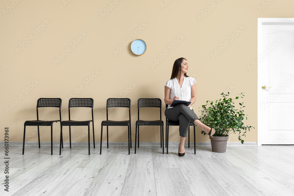 Young woman waiting for job interview in office