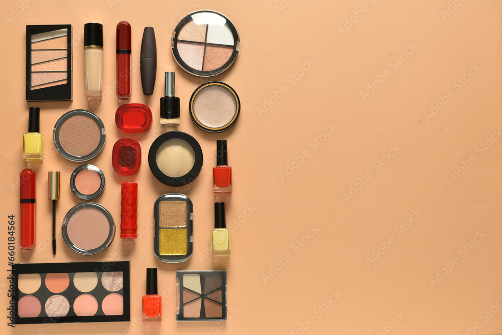 Different decorative cosmetics on orange background