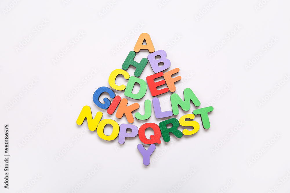 Christmas tree made of wooden letters on white background