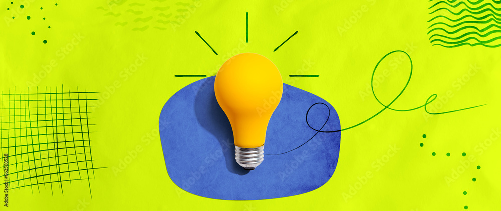 Yellow light bulb with handwritten sketch - flat lay