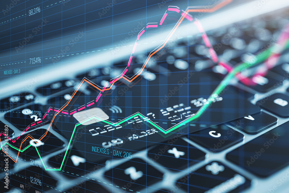 Close up of laptop with bank card and creative business graph with index and grid on blurry background. Stock market and financial statistics concept. Double exposure.