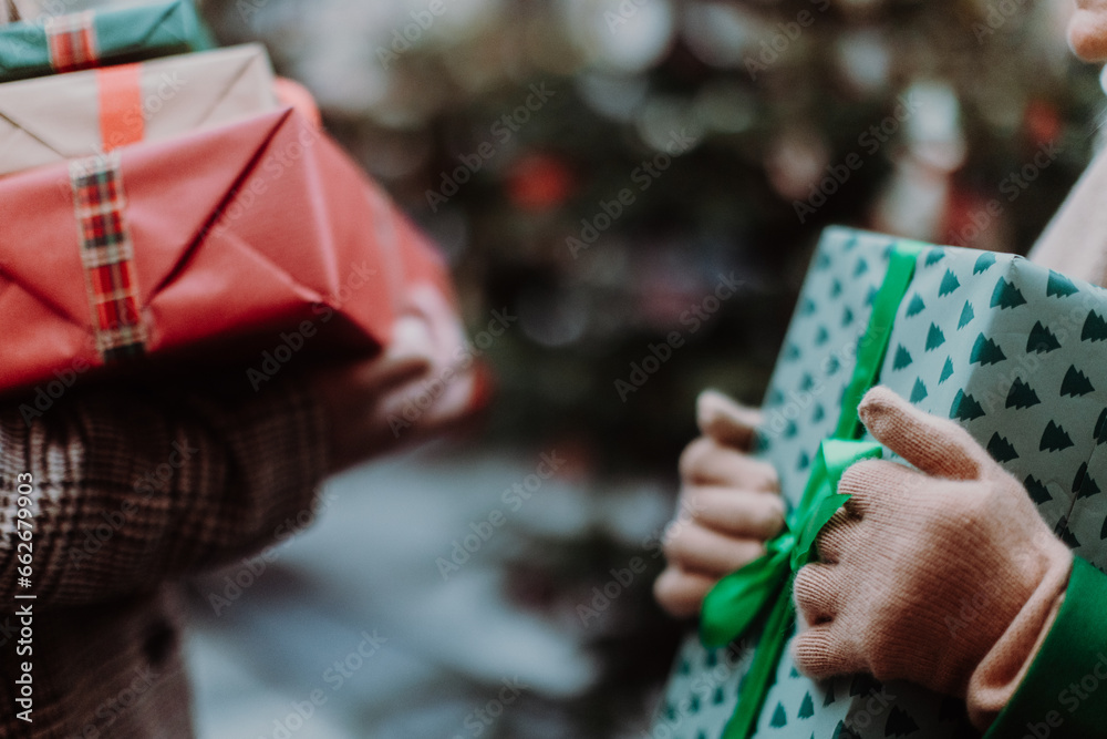 Close up of lot of Chrismtas gifts in hands.