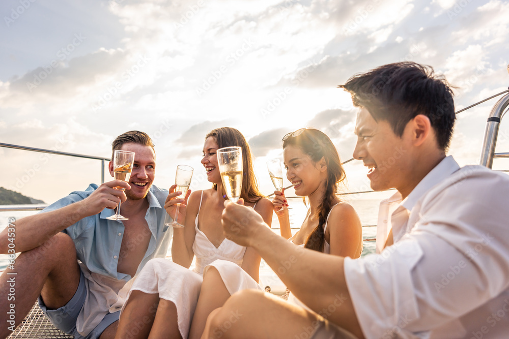 Group of diverse friends drink champagne while having a party in yacht.