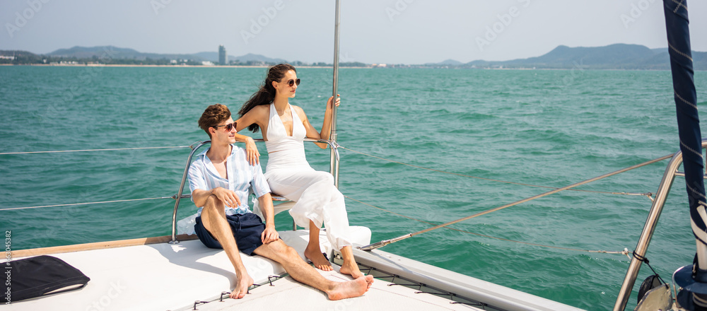 Caucasian romantic couple looking at beautiful view during yachting. 