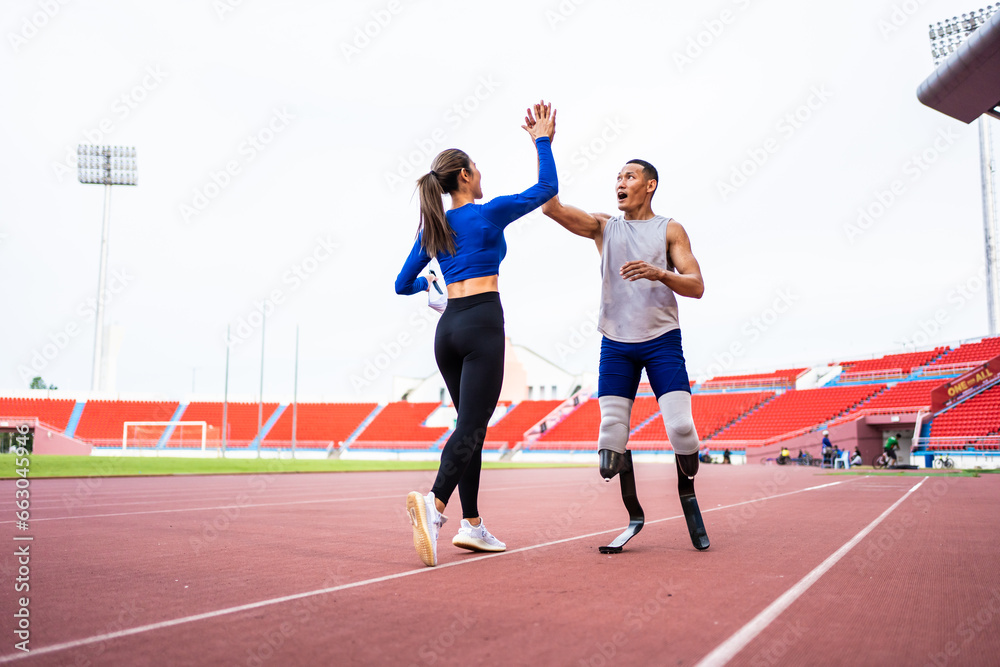 Asian athlete with prosthetic blades and trainer workout in stadium.