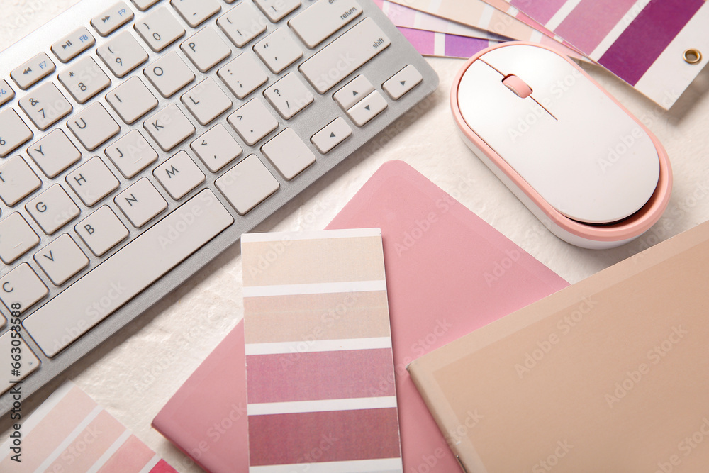 Color palettes, PC keyboard and notebooks on light background