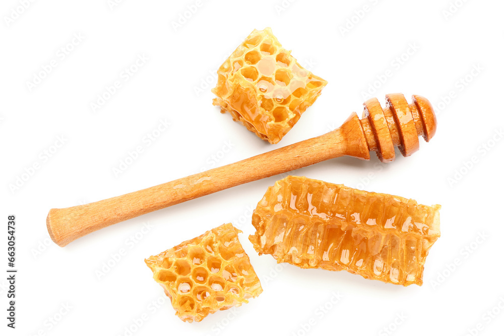 Sweet honeycombs and dipper on white background