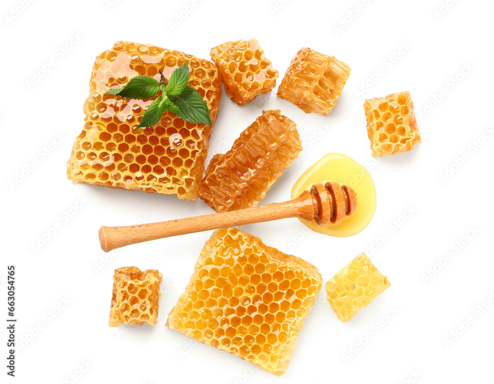 Sweet honeycombs and dipper on white background