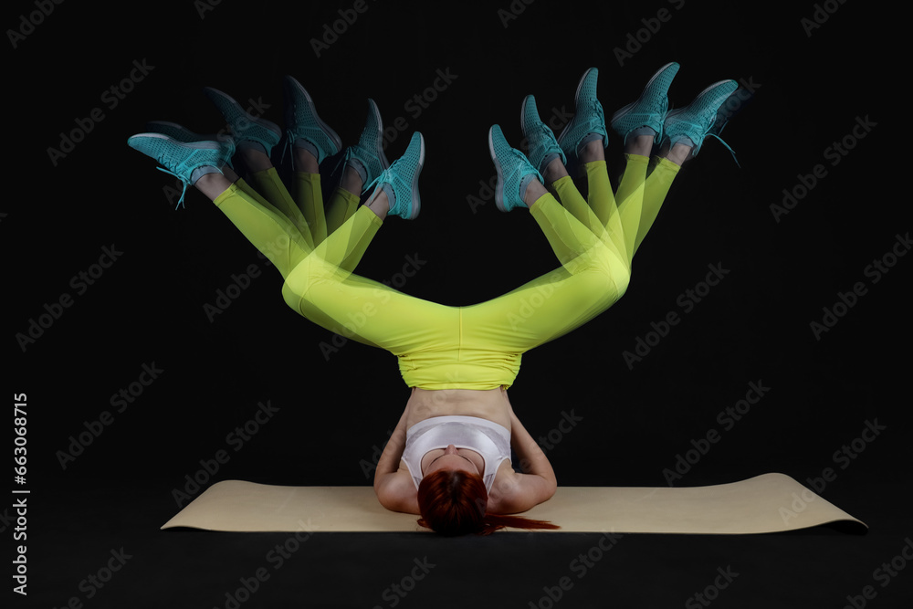 Young fitness trainer in motion on dark background