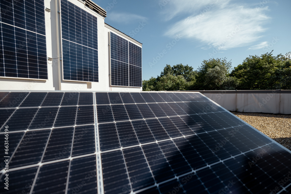 Rooftop of a privat house with a solar power station on it during a sunny day