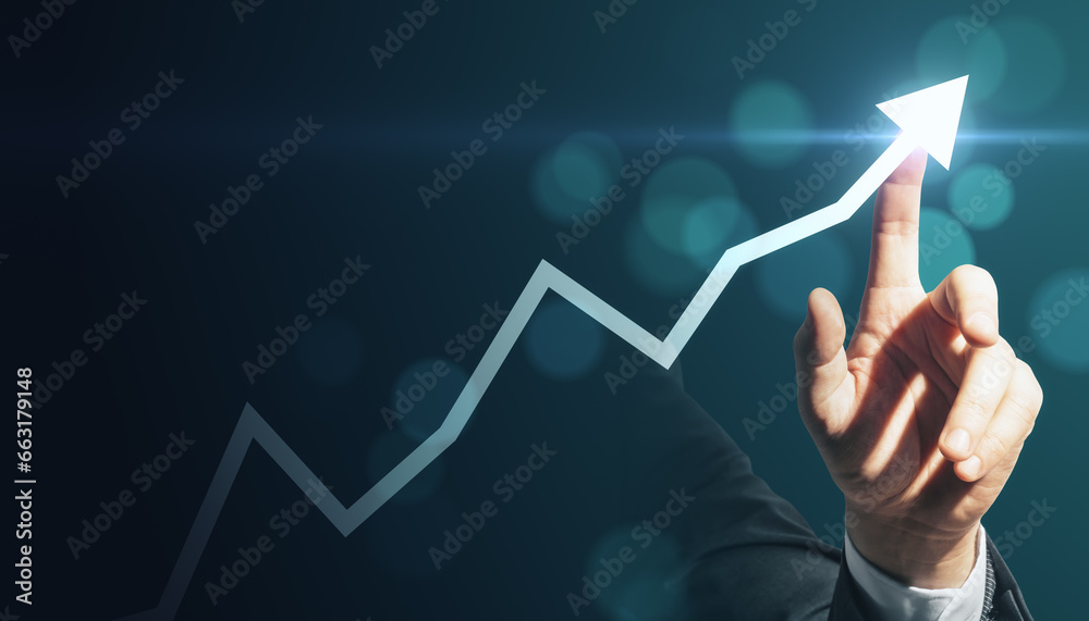 Close up of businessman hand pointing at creative glowing upward arrow on blurry glowing blue bokeh circles background. Growth, success business and up concept. Toned image.