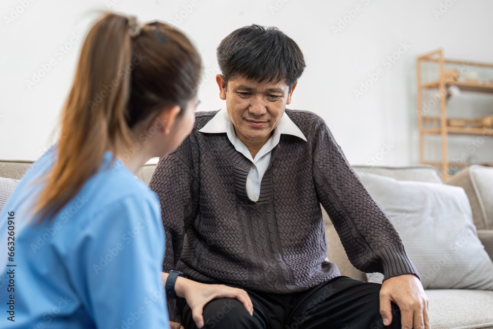 physiotherapist doctor or caregiver helping senior elderly man stretching his hamstring