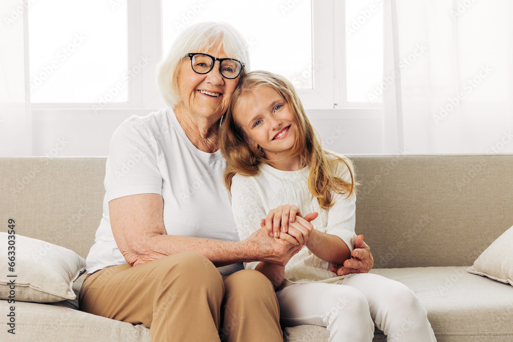 Girl granddaughter child grandmother couch sofa