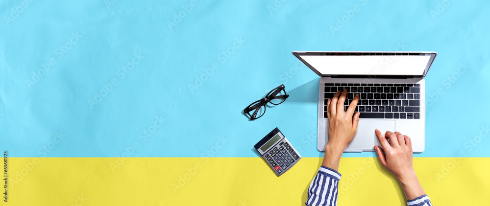 Person using a laptop computer from above